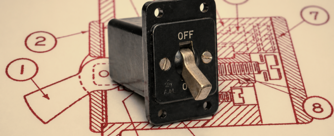 An original Air Ministry Switch Type B (5C/543) photographed in the off position, placed on a red-line technical drawing from AP1095A showing the switch mounting details